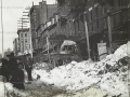 Children playing in dirty snow banks