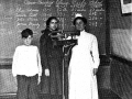 School nurse weighing and measuring pupils